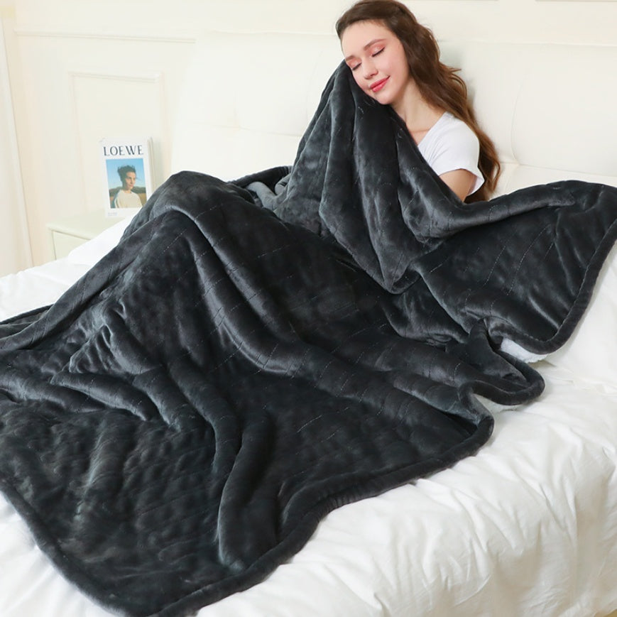 Electric heated flannel throw blanket on sofa