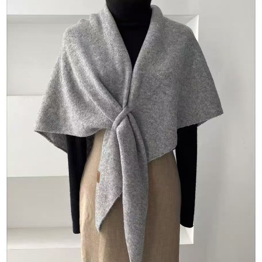 Woman wearing a wool triangle shawl