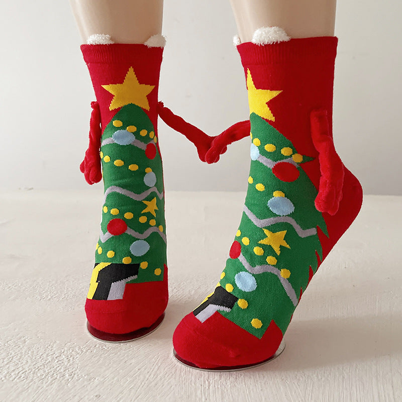 Couple wearing magnetic Christmas socks