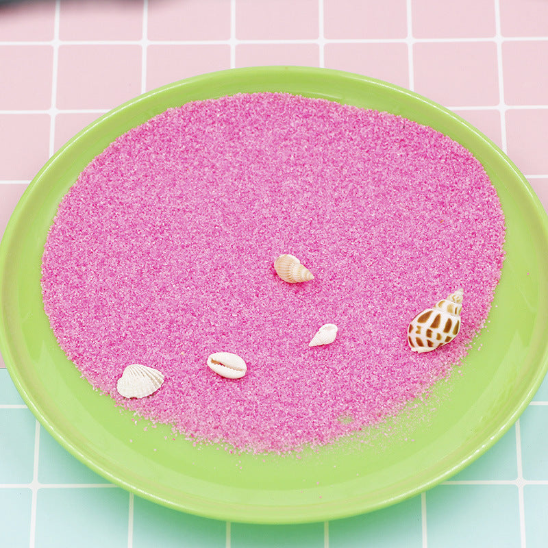 Colorful magic sand in water