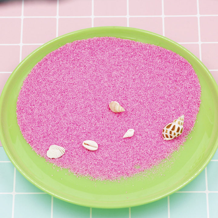 Colorful magic sand in water
