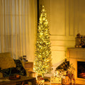 Green pre-lit pencil tree with warm lights