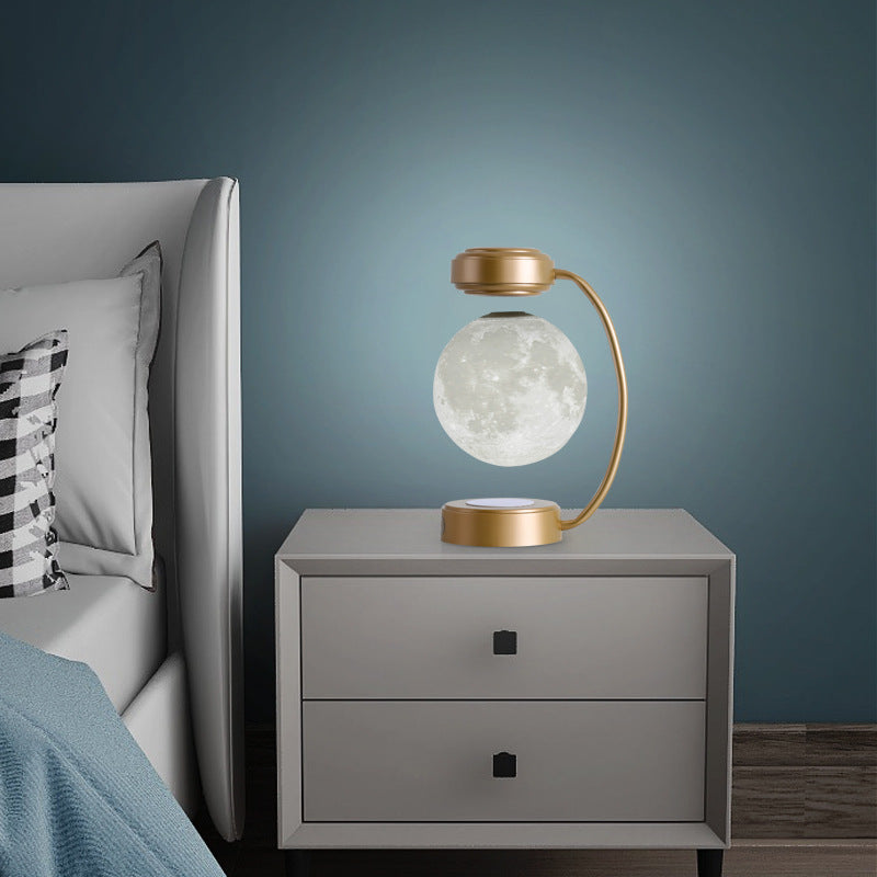 Floating moon lamp under arched holder
