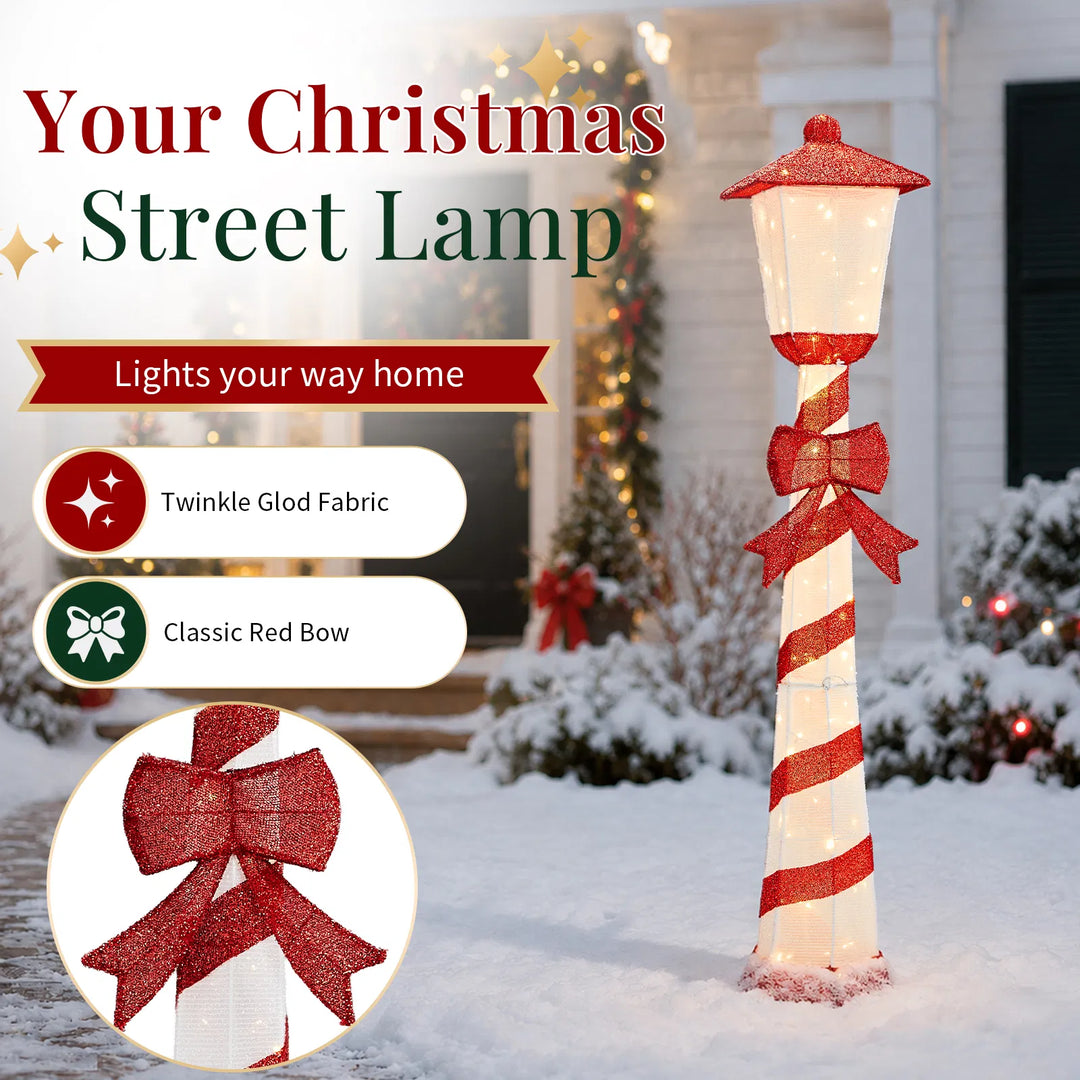Lighted candy cane striped Christmas lamp post on a porch