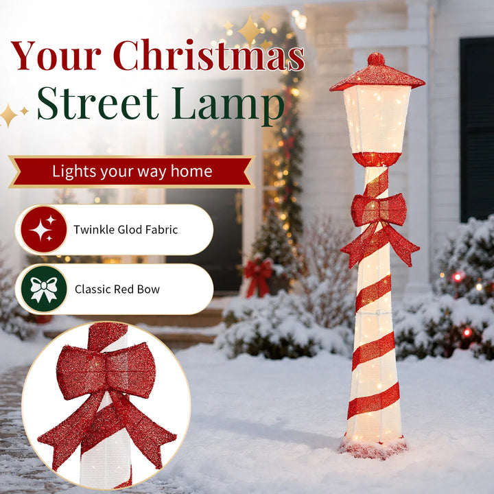 Lighted candy cane striped Christmas lamp post on a porch