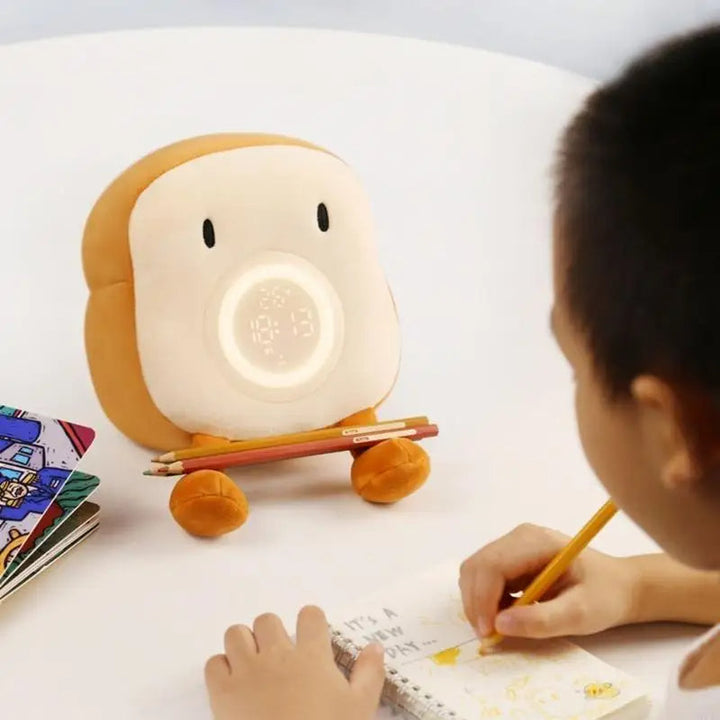 Colverro™ Toast Plush Alarm Clock with Dimmable Night Light and Phone Stand