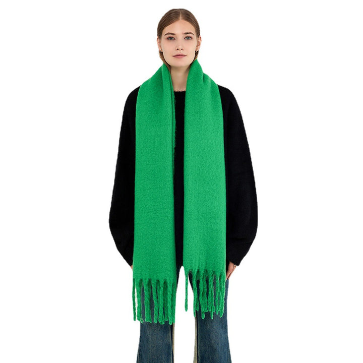 Woman wearing a fluffy royal blue scarf