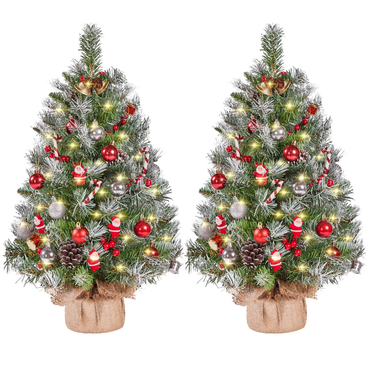 Two frosted tabletop trees with lights