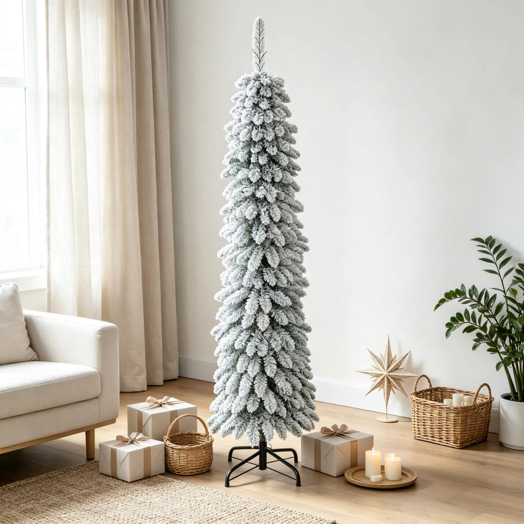 Slim snow flocked pencil Christmas tree in corner
