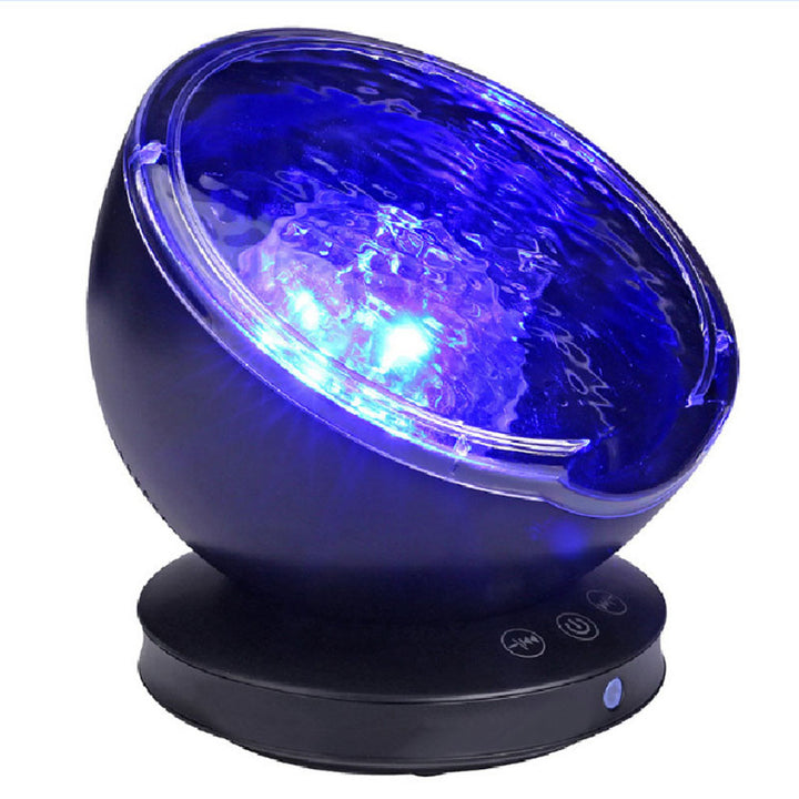 Ocean wave projector lighting a bedroom