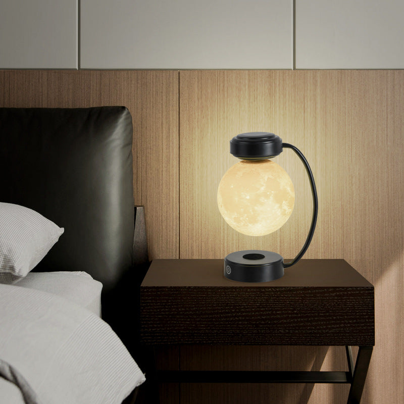 Floating moon lamp under arched holder