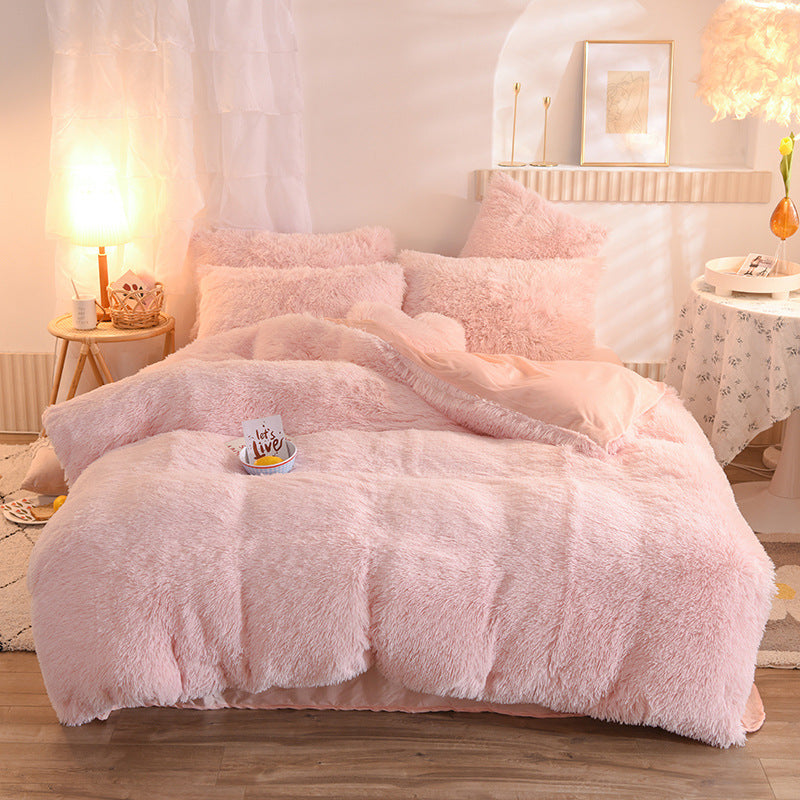 Fluffy plush bedding set on a bed