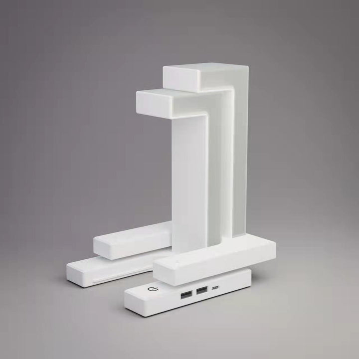 White floating lamp charging a phone