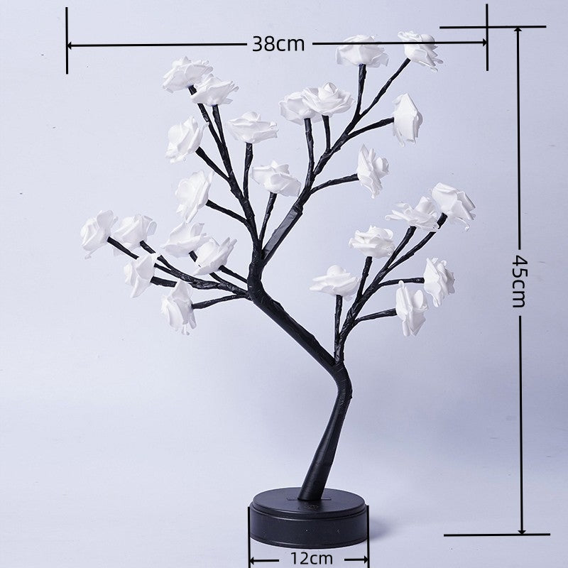 Glowing rose tree lamp on a table