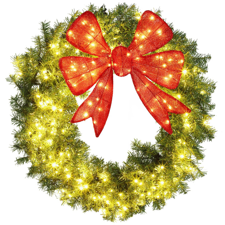 Large lighted Christmas wreath with red bow