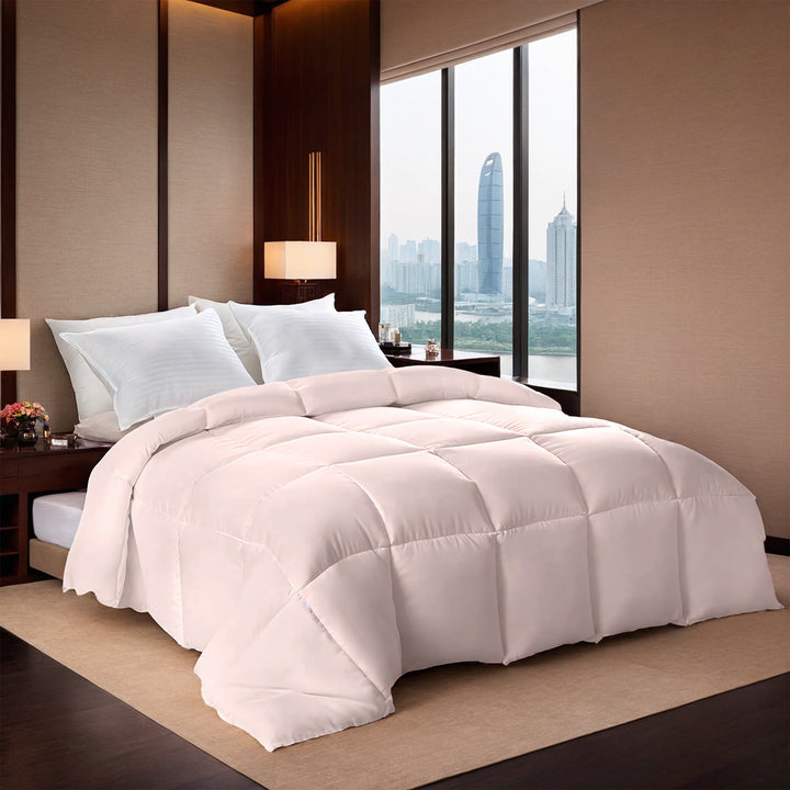 Pink box stitched comforter on a bed