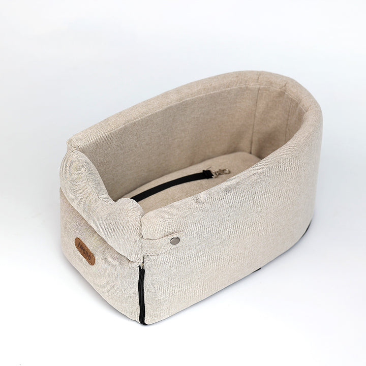 Small dog in armrest car seat bed