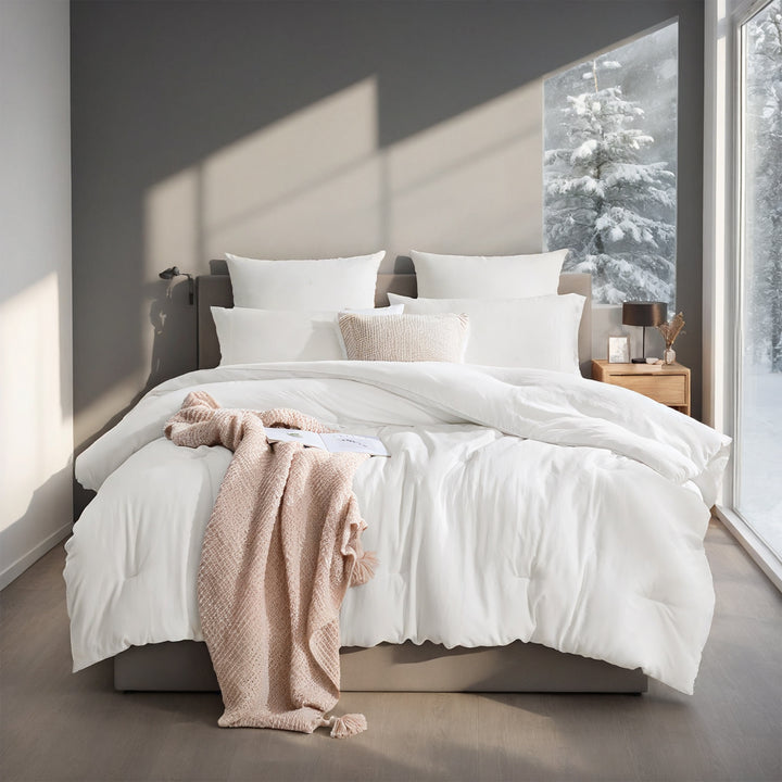 White box stitched comforter on a bed