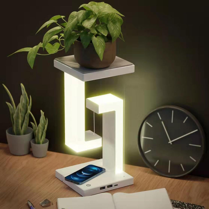 White floating lamp charging a phone