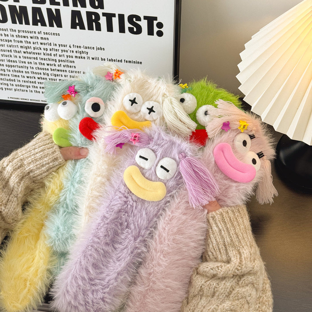Fluffy green plush socks with googly-eyed monster faces