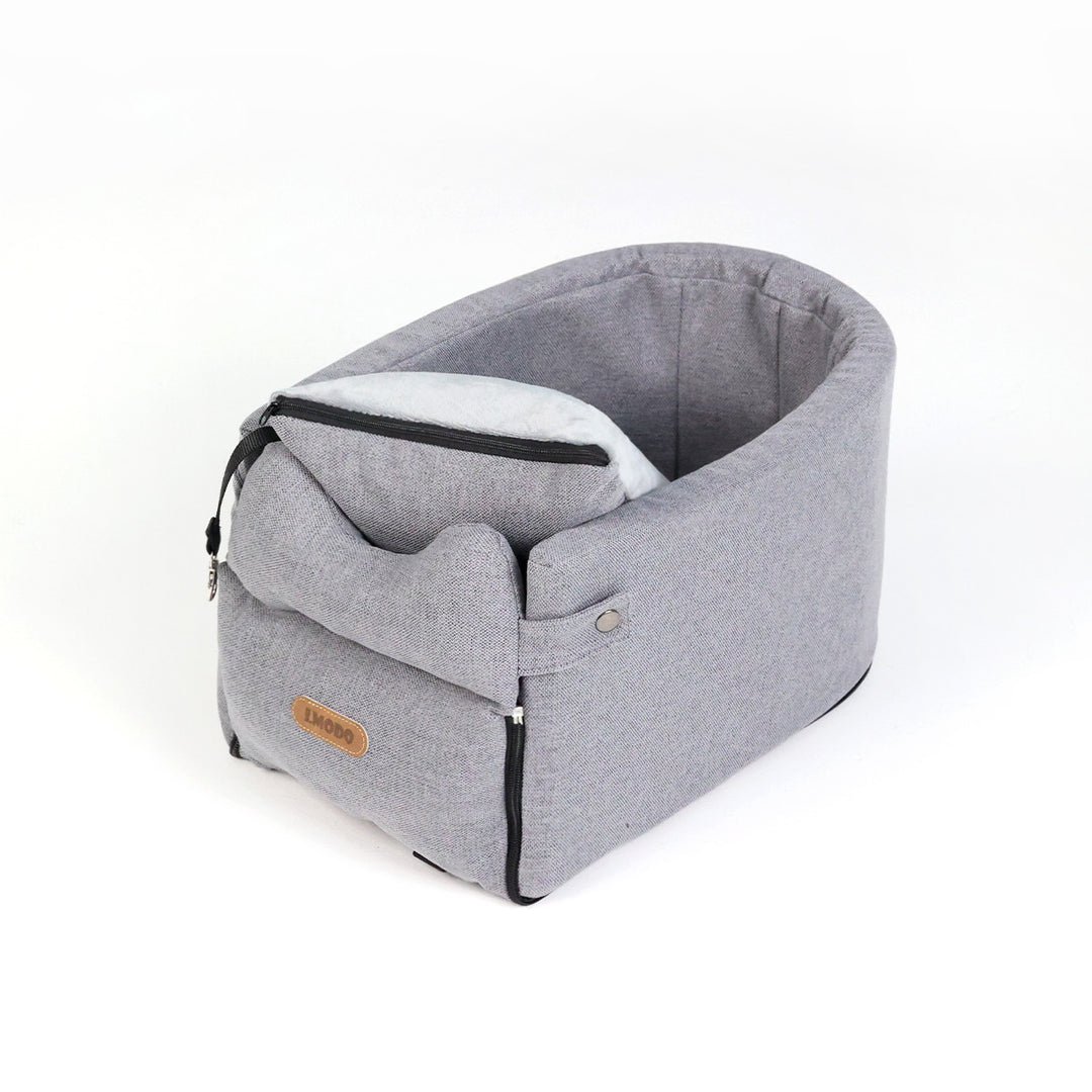 Small dog in armrest car seat bed