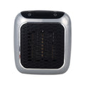 Mini plug in heater on a wall outlet