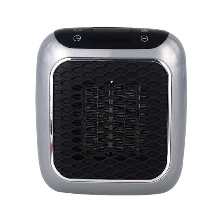 Mini plug in heater on a wall outlet