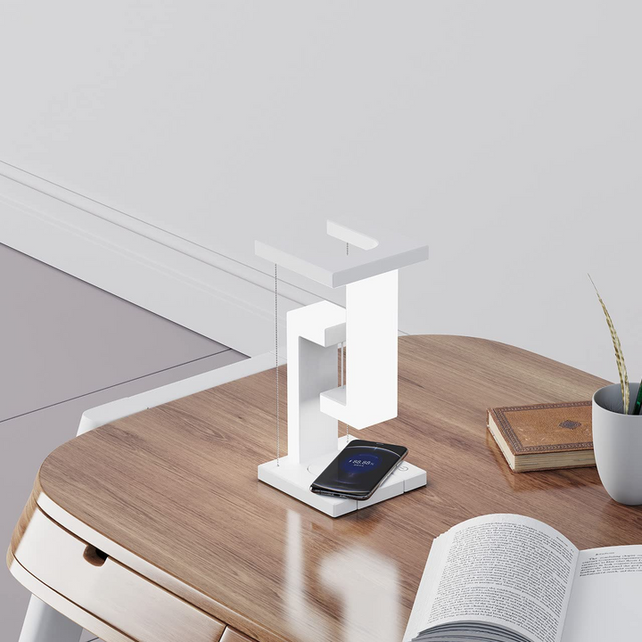 White floating lamp charging a phone