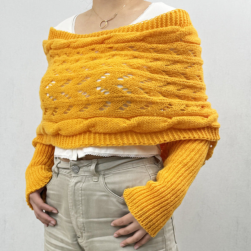Woman wearing a knit shawl with sleeves