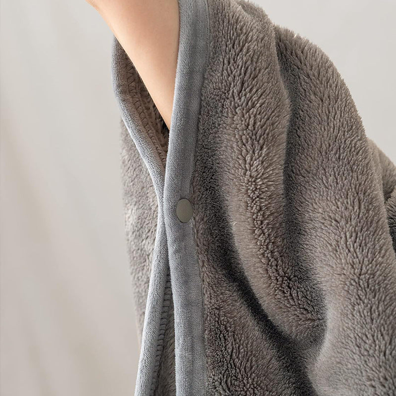 Fleece blanket worn as shawl with buttons