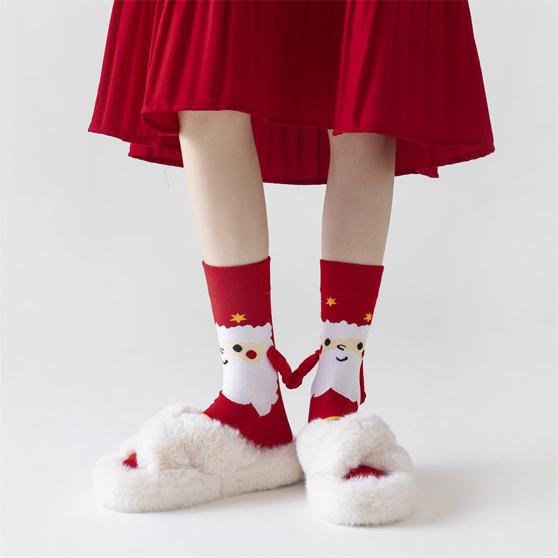 Couple wearing magnetic Christmas socks