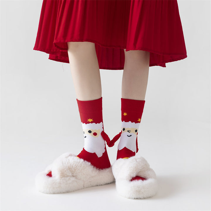 Couple wearing magnetic Christmas socks