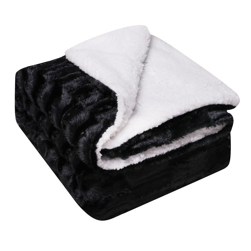 Thick sherpa fleece throw on a sofa