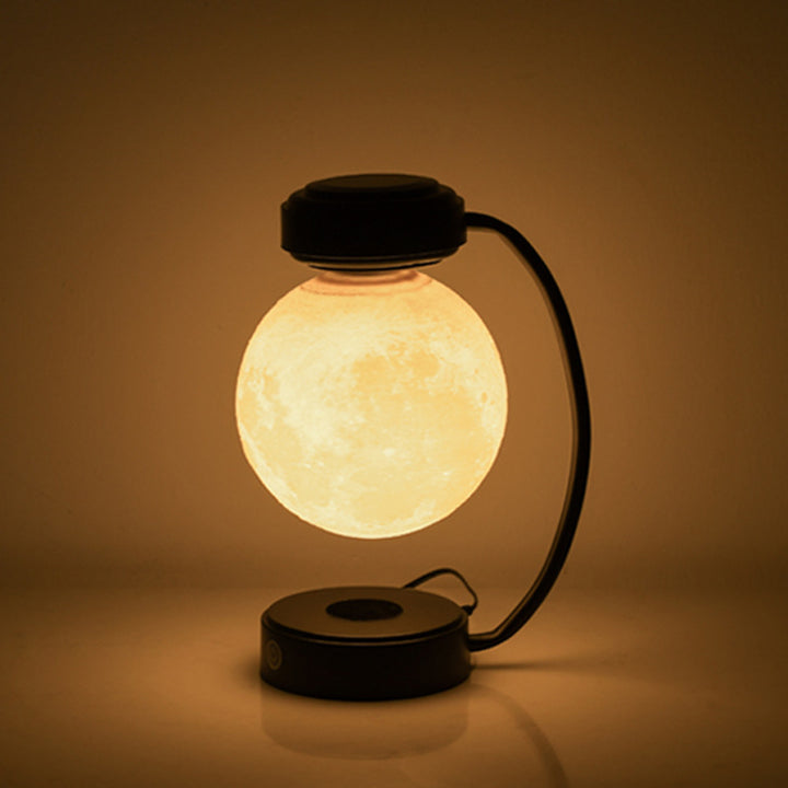 Floating moon lamp under arched holder