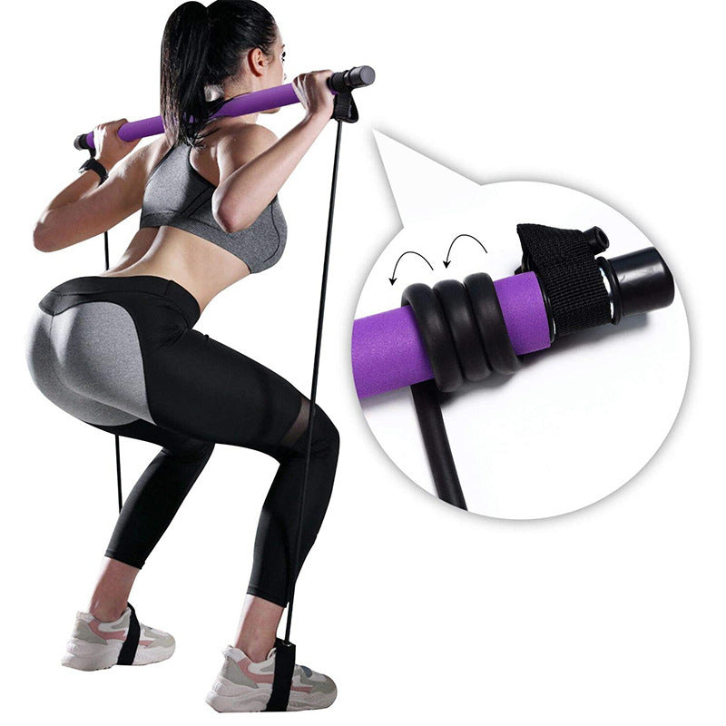 Woman training with a pilates bar