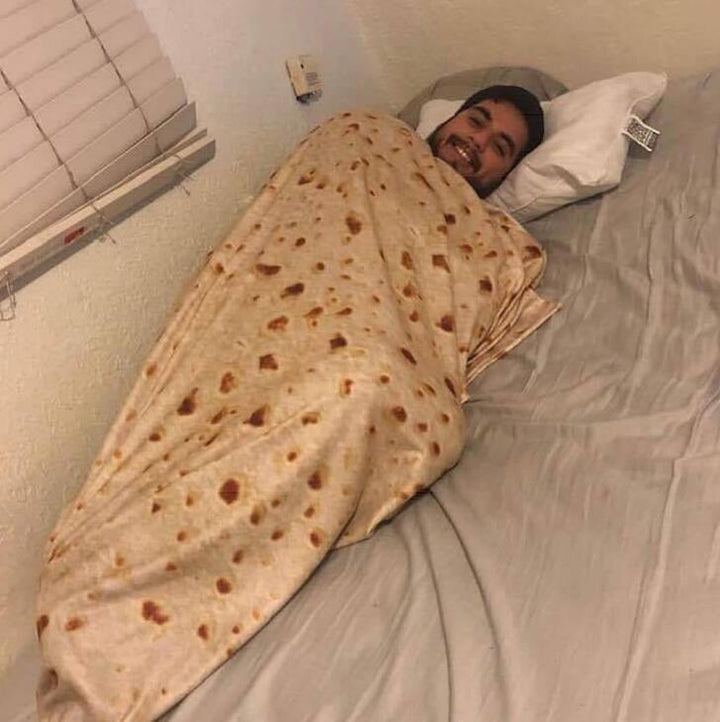 Person wrapped in a tortilla blanket