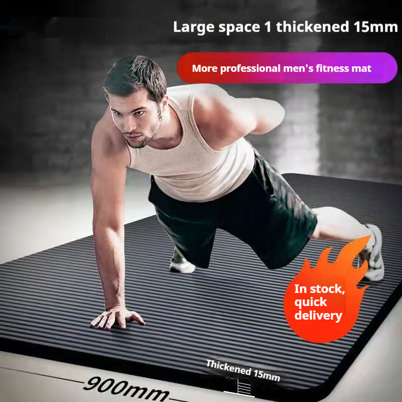 Rolled black yoga mat with carry strap