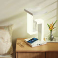 White floating lamp charging a phone