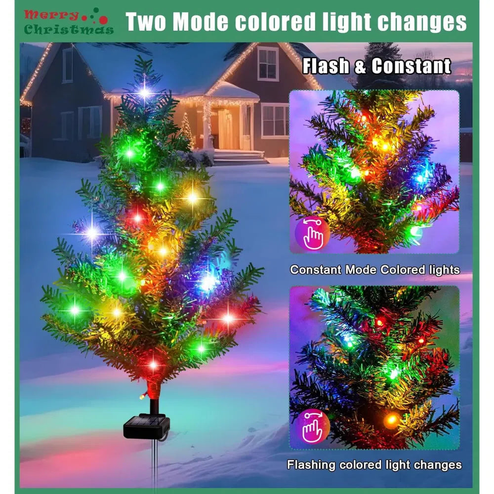 Four solar mini Christmas trees glowing along a path
