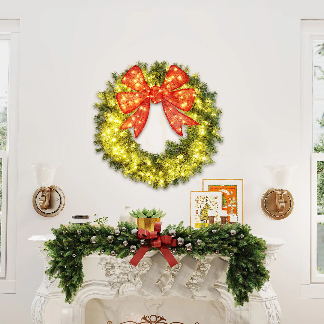 Large lighted Christmas wreath with red bow