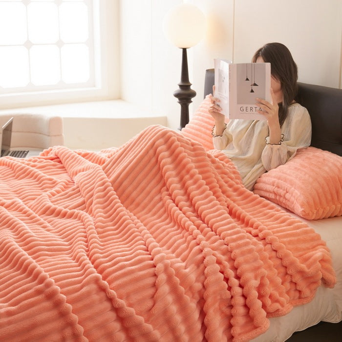Ribbed faux rabbit fur blanket on bed