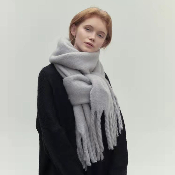 Woman wearing a long camel scarf
