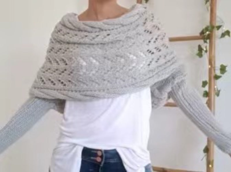 Woman wearing a knit shawl with sleeves