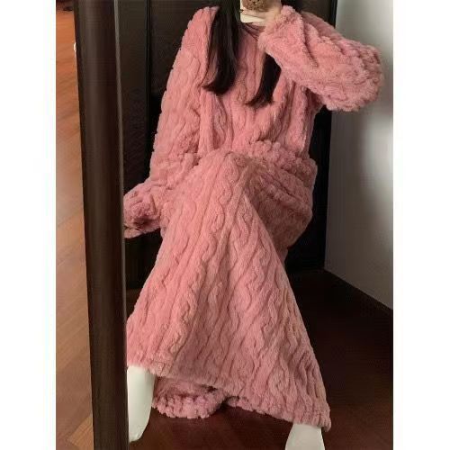 Woman in a long pink fleece nightgown