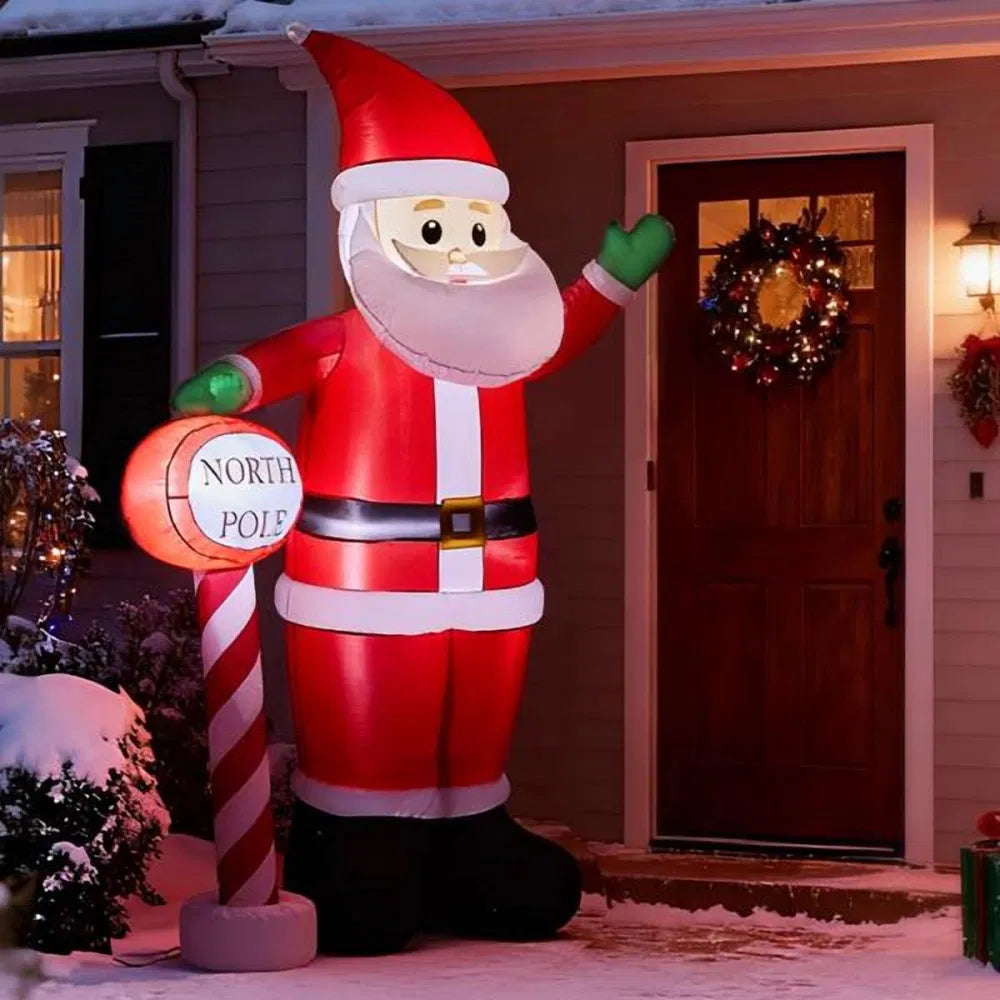 Giant inflatable Santa waving with sign