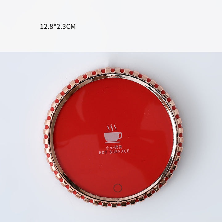 Mug on a round heated coaster with metallic rim