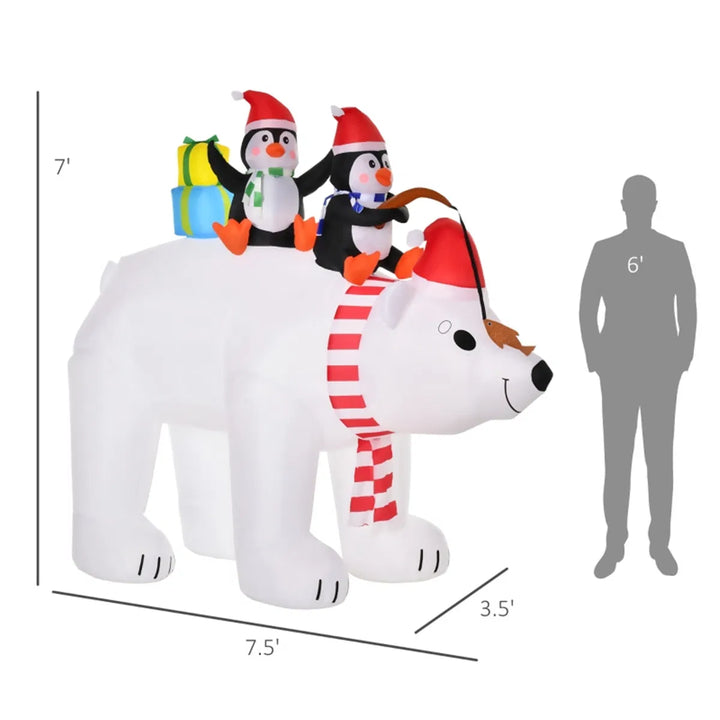 Inflatable polar bear with two penguins