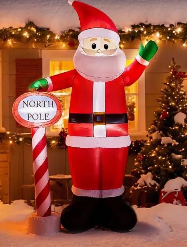 Giant inflatable Santa waving with sign