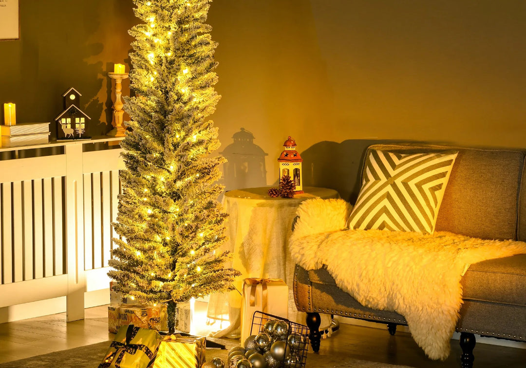 Green pre-lit pencil tree with warm lights