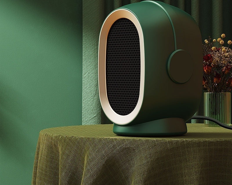 Compact ceramic space heater on desk